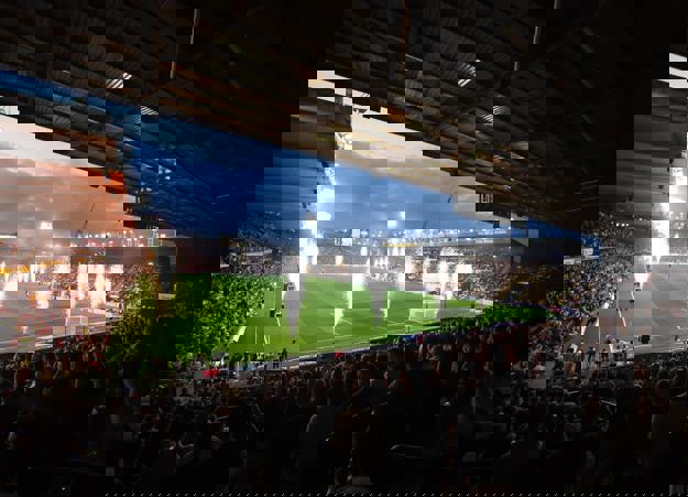An image of a fireworks display in front of the crowd before a football match at Watford Football Club's stadium.